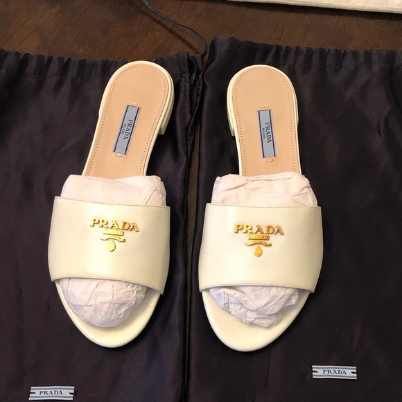 Prada Shoes - Prada Gold Logo Cream Sandals. New.